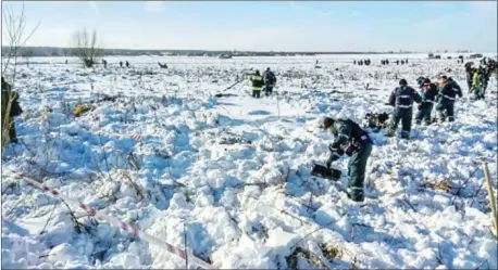  ?? MINISTRY/AFP RUSSIAN EMERGENCY ?? Emergency rescuers work at the site of the plane crash in Ramensky district, on the outskirts of Moscow, yesterday.