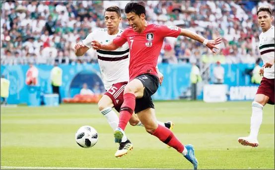  ??  ?? South Korea’s Son Heung-min (right), and Mexico’s Hector Moreno challenge for the ball during the Group F match between Mexico and South Korea at the 2018 soccer World Cup in the RostovAren­a in Rostov-on-Don, Russia on June 23. (AP)