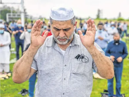  ?? REUTERS ?? Mourners pray Saturday at the funeral of the Afzaal family that was killed in what police describe as a hate-motivated attack, at the Islamic Centre of Southwest Ontario, in London.