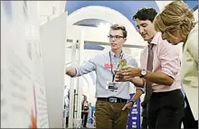  ?? Contribute­d photo ?? Summerland student Grant Mansiere discusses his science fair project with Prime Minister Justin Trudeau earlier this week in Ottawa.