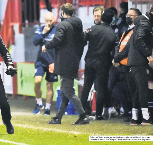  ??  ?? Grimsby Town manager Ian Holloway celebrates the victory over Crawley Town at The People’s Pension Stadium on Tuesday night.