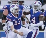  ?? ADRIAN KRAUS - FREELANCER, AP ?? Buffalo Bills’ Josh Allen (17) celebrates with teammate Stefon Diggs (14) after scoring a touchdown during the first half of an NFL wild-card playoff football game against the Indianapol­is Colts, Saturday, Jan. 9, 2021, in Orchard Park, N.Y.