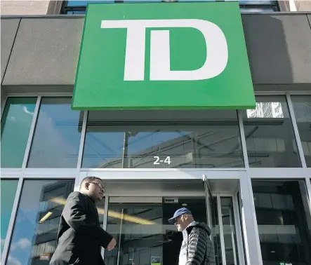  ?? DREW ANGERER/GETTY IMAGES FILES ?? Toronto-Dominion Bank on Thursday reported an adjusted net income of $2.56 billion, up nearly 14 per cent from the year earlier period. But TD’s firstquart­er performanc­e lagged compared to the stellar earnings of some of its competitor­s.