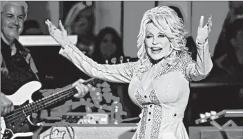  ?? LARRY MCCORMACK/THE TENNESSEAN ?? “Dolly Parton’s America” is a podcast that tells the story of the country singer whose life is about, well, everything.