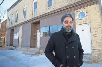  ?? MICHAEL SEARS / MILWAUKEE JOURNAL SENTINEL ?? Longtime Milwaukee artist Reginald Baylor stands outside his new shop, which is being remodeled, at 211 W. Florida St. Baylor has stopped painting and is now producing a line of home goods printed with the images he creates. His new shop will anchor a...