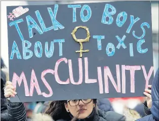  ?? CP PHOTO ?? A woman holds up a sign during a women’s demonstrat­ion in Montreal, Jan. 20.