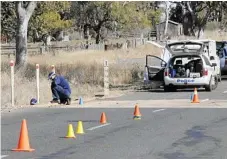 ??  ?? SEARCH: Detectives and forensic officers search for evidence in the murder of Pittsworth teen Robert Rowlingson.