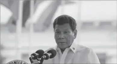  ??  ?? MANILA
Philippine President Rodrigo Duterte delivers his speech during the 123rd anniversar­y of the proclamati­on of the Philippine independen­ce rites at the Provincial Capitol of Bulacan province, Philippine­s. -AP