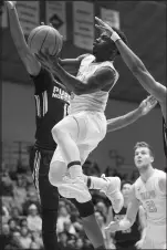  ?? KYLE TELECHAN/POST-TRIBUNE ?? Valparaiso guard Daniel Sackey, right, takes the ball up past Purdue Northwest forward Durante Lee on Saturday.