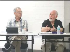  ?? The Sentinel-Record/Richard Rasmussen ?? LIABILITIE­S ABOUND: Dr. Jack Porter, left, listens to retired Col. Mike White discuss some of the challenges facing the former Army and Navy General Hospital Monday.