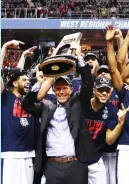  ?? (Reuters) ?? MARK FEW (center) has coached Gonzaga to a one-loss season so far and to the first Final Four trip in school history. The Zags, who won the West Regional as a No. 1 seed, face South Carolina on Saturday in the NCAA Tournament semifinals.
