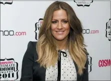  ?? JONATHAN SHORT — THE ASSOCIATED PRESS FILE ?? In this file photo dated Thursday, Nov. 3, 2011, British TV personalit­y Caroline Flack arrives for the Cosmopolit­an Ultimate Women of the Year Awards in London.