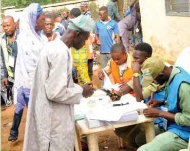  ??  ?? People being accredited with a card reader at Sekonanear Ife, during the 2018 Osun State Governorsh­ip Election (File Photo)