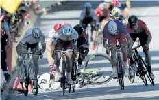  ?? CHRISTOPHE ENA/THE ASSOCIATED PRESS ?? Peter Sagan of Slovakia, left, sprints as Britain’s Mark Cavendish crashes, during the fourth stage of the Tour de France which started in Mondorf-lesBains, Luxembourg, and finished in Vittel, France, Tuesday. World champion Sagan has been disqualifi­ed...