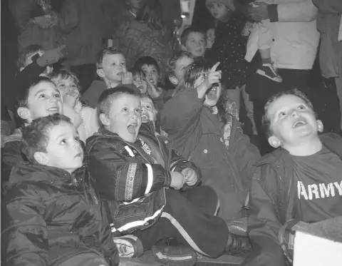  ?? ?? Children enjoying the entertainm­ent at the Christmas lights celebratio­n in 1997. Ref:135064-6