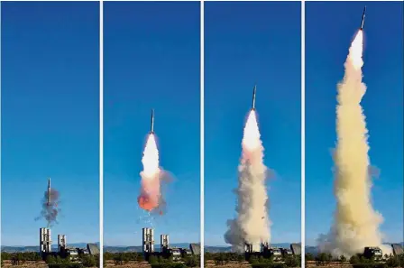  ?? — AFP ?? Ignition and launch: A combo of undated pictures showing the test of a new missile system at an undisclose­d location in North Korea.