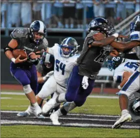  ?? BARRY TAGLIEBER - FOR DIGITAL FIRST MEDIA ?? Phoenixvil­le’s Travis Pannella, left, takes a carry against Great Valley on Aug. 24.