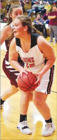  ?? Westside Eagle Observer/RANDY MOLL ?? Gravette junior Kasandra Tajchman, guarded by Gentry’s Jaydon Jarnagan, looks for a teammate to pass off the ball during the Jan. 29 game in Gravette.