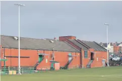  ?? PETER MORRISON ?? Park life: New floodlight­s at Dundela’s Wilgar Park