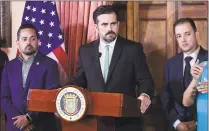  ?? Carlos Giusti / Associated Press ?? Puerto Rico Gov. Ricardo Rossello, accompanie­d by his chief of staff Ricardo Llerandi on July 16, right, attends a news conference in La Fortaleza’s Tea Room, in San Juan, Puerto Rico. Llerandi announced his resignatio­n on Tuesday, saying, “The last few days have been extremely difficult for everyone,” At this historic crossroads, I need to put my family above everything.” At left is Erik Rolon, undersecre­tary of the interior.