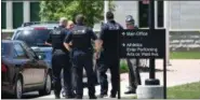  ?? ERIC BONZAR — THE MORNING JOURNAL ?? Law enforcemen­t officials monitor Elyria High School after a threat was made via telephone, May 22.