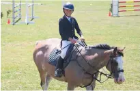  ?? ?? Local 13-year-old Zara Von Dadelzen impresses over a jump in the 1.05m event on Ngahiwi Roany Pony, and then the pair relax after completing a clear round.