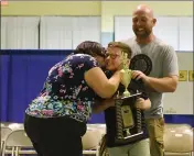  ??  ?? Jackson Ady celebrates with his family after winning the Solano County Spelling Bee on Tuesday in Vallejo.