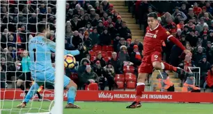  ?? AP ?? Liverpool’s Roberto Firmino scores a goal against Swansea City in the Premier League match. —