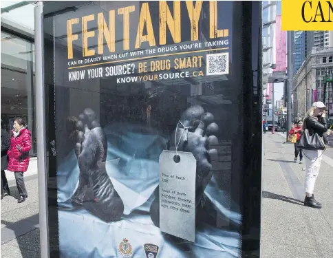  ?? THE CANADIAN PRESS/FILES ?? An anti-fentanyl advertisem­ent is seen in downtown Vancouver last year. New government figures show that nearly 4,000 Canadians died from apparent opioid overdoses last year, with men the most likely victims and fentanyl the clear culprit.