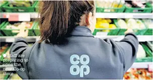  ?? Staff are preparing to open the new Co-op store ??