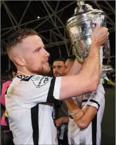  ??  ?? Sean Hoare lifts the Cup, and below, netting Dundalk’s opening goal.