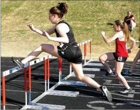  ?? Westside Eagle Observer/RANDY MOLL ?? Keri Rollo of Gravette clears her first hurdle in competitio­n at the Gravette High School Relays track meet on March 15.