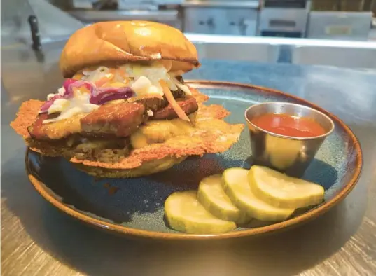  ?? GENUINE BISTRO ?? The Brisket Burger from Genuine Bistro, soon to be The Salted Goat, in Debary.