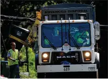  ?? AJC 2010 ?? Solid waste haulers experience­d increased labor costs and supply chain issues, like many other industries. But they also contended with an increased volume of trash and recycling as the coronaviru­s pandemic caused a mass shift to working from home.