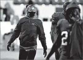  ?? JULIO CORTEZ/AP ?? Tampa Bay Buccaneers assistant strength and conditioni­ng coach Maral Javadifar looks on following a playoff game in Landover, Md.