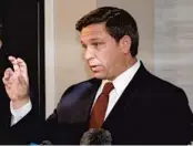  ?? TERRY RENNA/AP ?? Gov. Ron DeSantis speaks during a coronaviru­s response meeting at the West Palm Beach Internatio­nal Airport on Friday in West Palm Beach.