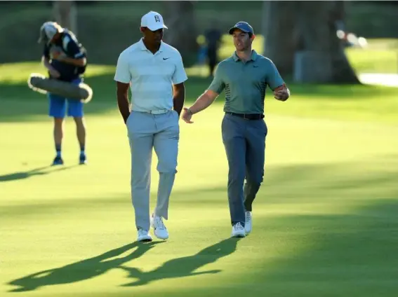  ?? (Getty Images) ?? Tiger Woods and Rory McIlroy have given golf a welcome boost