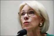  ?? JACQUELYN MARTIN - THE ASSOCIATED PRESS ?? In this May 22 file photo, Education Secretary Betsy DeVos testifies at a House Committee on Education and the Workforce, on Capitol Hill in Washington. The Trump administra­tion is rescinding Obama-era guidance that encouraged schools to take a...