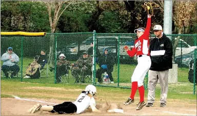  ?? MIKE CAPSHAW ENTERPRISE-LEADER ?? Farmington first baseman Callie Harper elevates to catch a high throw on a pick-off attempt during a 9-8 loss against Pottsville in the Farmington/Fayettevil­le Tournament at Fayettevil­le’s Lady Dawg Yard on March 19.