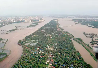  ?? PTI ?? An aerial view of the floods in Kerala’s Aluva after heavy rains. Expats from the state in the UAE are worried over the situation. —