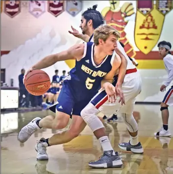  ?? Dan Watson/The Signal (See additional photos on signalscv.com) ?? West Ranch’s Robbie Myers (5) drives past a Viewpoint High defender at Bishop Alemany High School on Friday in The Warrior Classic hosted by Bishop Alemany and Heritage Christian.