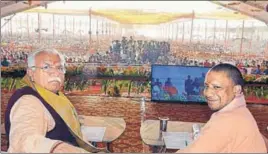  ?? HT PHOTO ?? ■ Haryana chief minister Manohar Lal Khattar and UP chief minister Yogi Adityanath at a function in Mathura in Uttar Pradesh on Saturday.