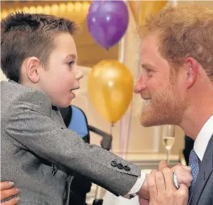  ?? Daniel Leal-Olivas ?? ●●Prince Harry and Ollie Carroll at the Wellchild Awards