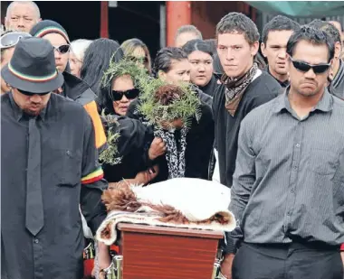  ??  ?? Goodbye: Loved ones mourn as the casket containing Casey Nathan and baby son Kymani Nathan-tukiri is carried from Waingaro Marae. Photo: Peter Drury/fairfax NZ