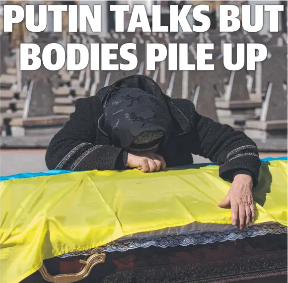  ?? ?? A mother mourns over her son’s coffin in Lviv as the Russian invasion of Ukraine enters its fourth week. Picture: Getty