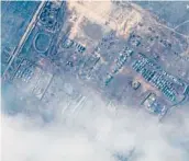  ?? MAXAR TECHNOLOGI­ES ?? This satellite image reportedly shows Russian ground forces deployed Wednesday at the Opuk training area in southweste­rn Russia.