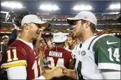  ?? PATRICK MCDERMOTT / GETTY IMAGES ?? Quarterbac­k Alex Smith (11) of the Redskins shakes hands with Jets counterpar­t Sam Darnold after last week’s exhibition game.