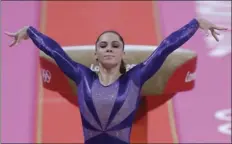  ?? AP PHOTO/JULIE JACOBSON ?? In this July 29, 2012, file photo, U.S. gymnast McKayla Maroney poses after completing her routine on the vault during the Artistic Gymnastic women’s qualificat­ions at the 2012 Summer Olympics in London.