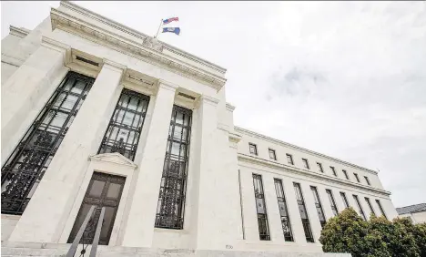  ?? ANDREW HARNIK/THE ASSOCIATED PRESS ?? The Marriner S. Eccles Federal Reserve Board Building is seen in Washington. The U.S. central bank on Wednesday raised its key short-term rate by a modest quarter-point to a still-low range of 1.75 per cent to two per cent.