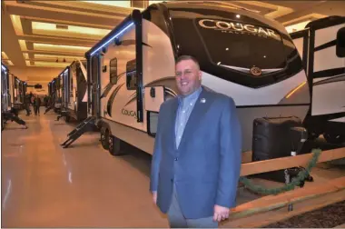  ?? LAUREN HALLIGAN - MEDIANEWS GROUP ?? Jonathan Baker, general sales manager at Alpin Haus, smiles at the 2020 Alpin Haus RV Show & Sale.